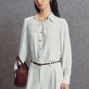Sơ mi DT họng cổ nhúm buộc dây Sơ mi DT họng cổ nhúm buộc dây