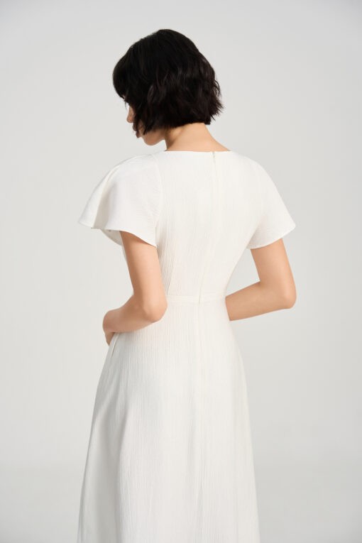 Đầm xoè cổ lệch dây buông đính cúc