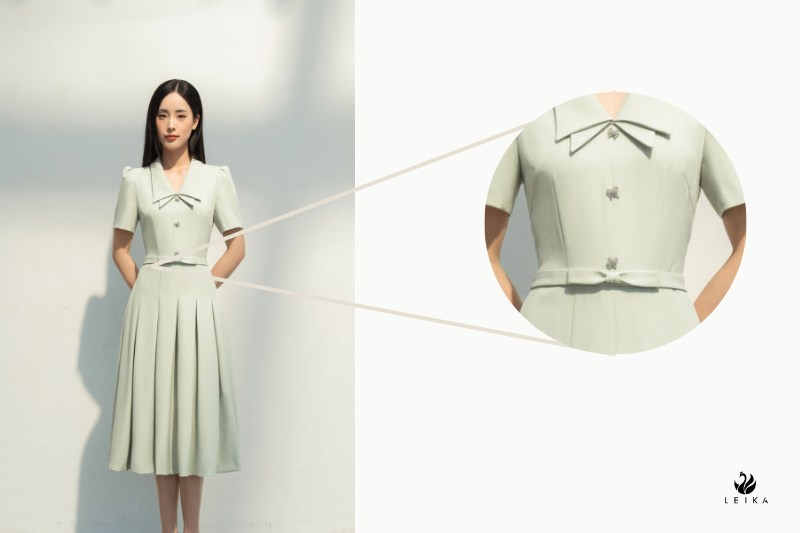Đầm xoè chiết ly đính nơ eo