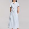 Sơ mi CT croptop xẻ gấu phối cổ Chân váy xoè nắp túi giả đai eo