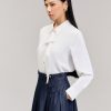 Chân váy xoè xếp ly đai trước kẹp sườn đính cúc Sơ mi DT bèo đôi kẹp nẹp cổ