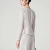 Áo kiểu peplum lệch xếp ly vai đính cúc
