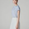 Sơ mi CT tay liền, cổ xếp ly lệch đính cúc