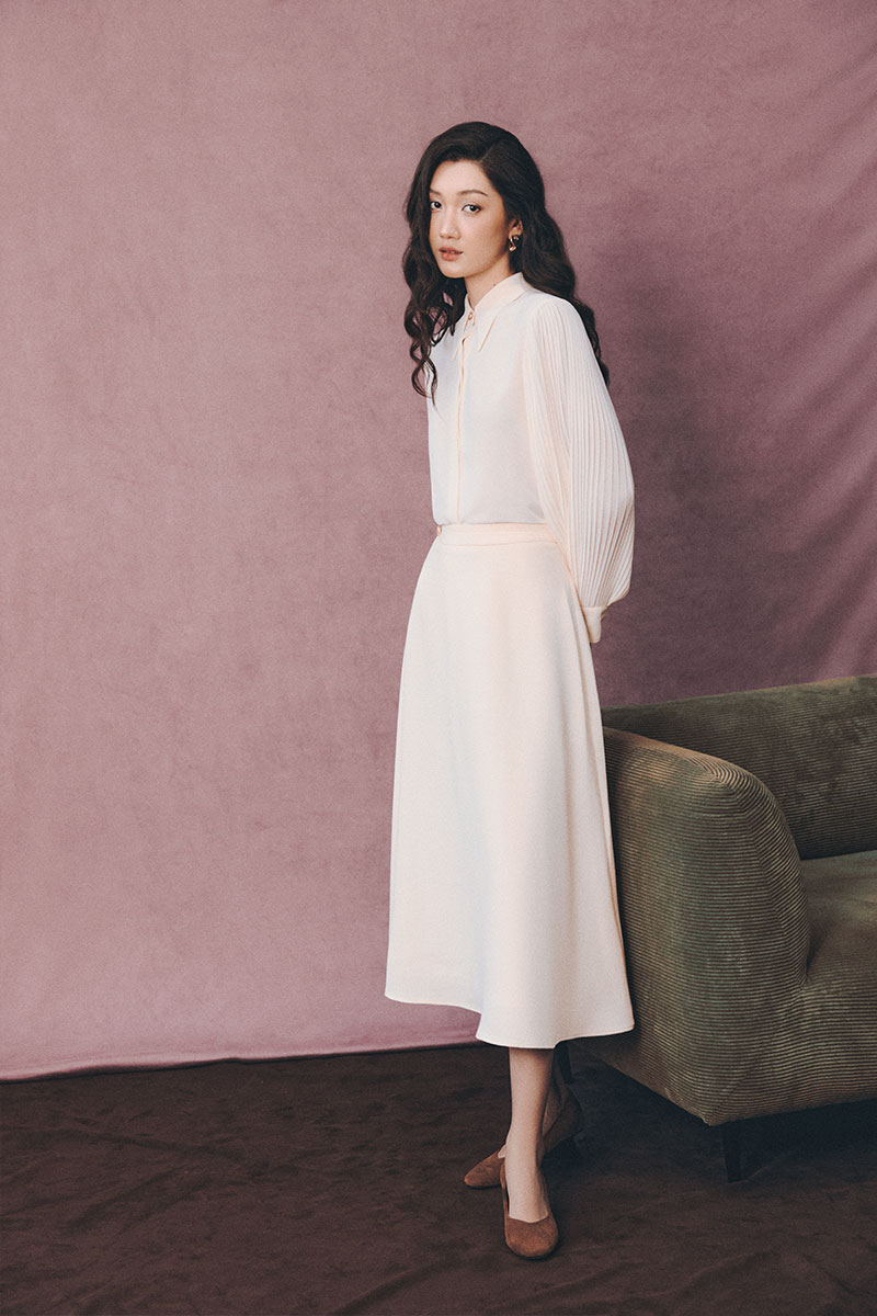 Chân váy text xoè cạp can chéo đính cúc