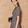 Đầm xoè cổ 2 ve đai eo vát
