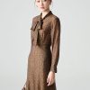 Đầm xoè hoạ tiết nơ cổ đai eo