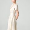 Đầm xoè tay cape đính cúc