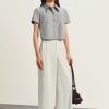 Sơ mi CT croptop nẹp bong đính cúc