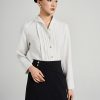 Chân váy xoè ly lệch bong eo đính cúc