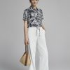 Sơ mi CT croptop hoạ tiết gấu buộc dây