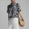 Sơ mi CT croptop hoạ tiết gấu buộc dây