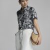 Sơ mi CT croptop hoạ tiết gấu buộc dây