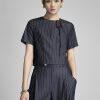 Sơ mi kiểu croptop cổ cài lệch đính nơ