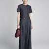 Sơ mi kiểu croptop cổ cài lệch đính nơ